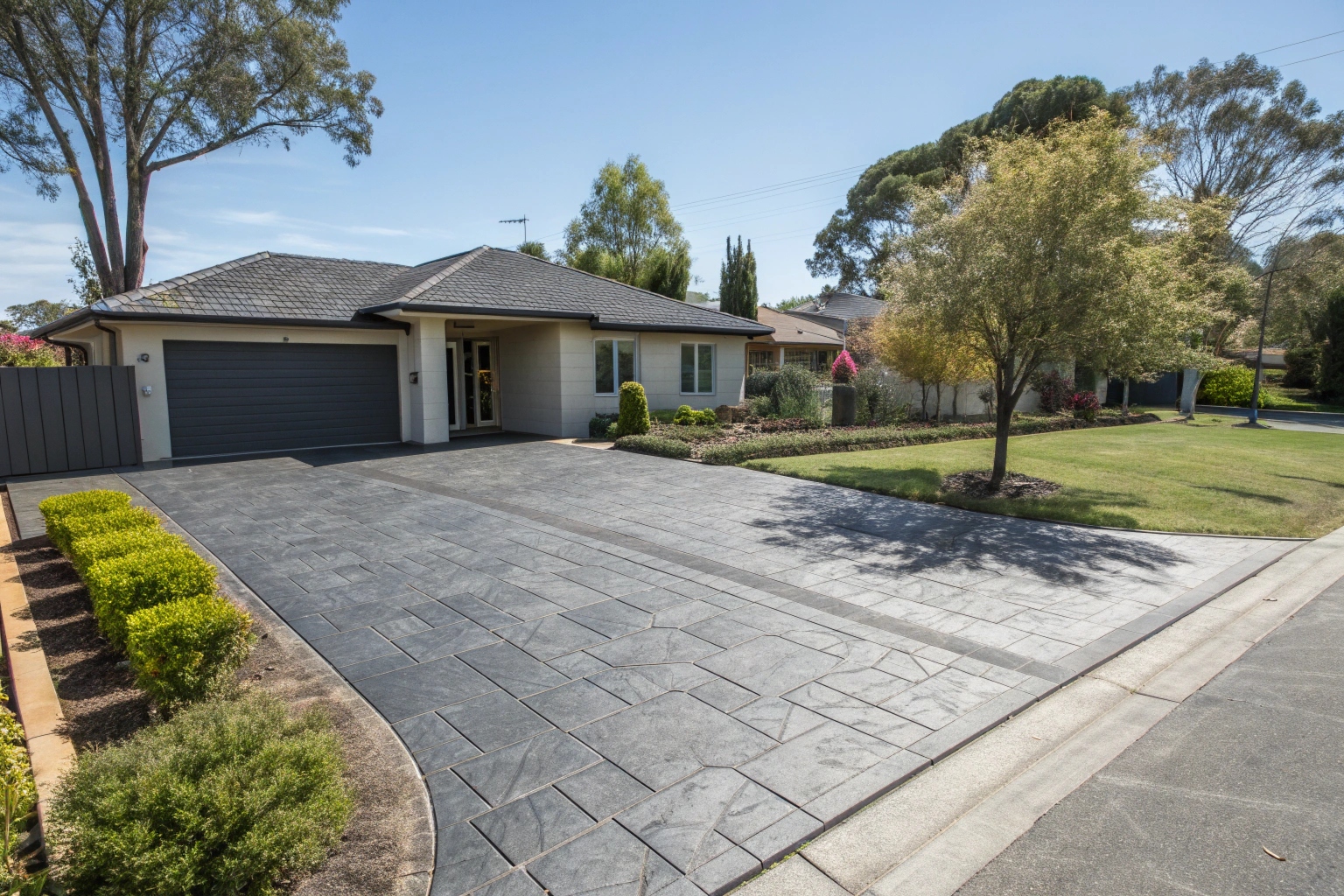 Stamped concrete driveway with ashlar slate pattern Canberra home